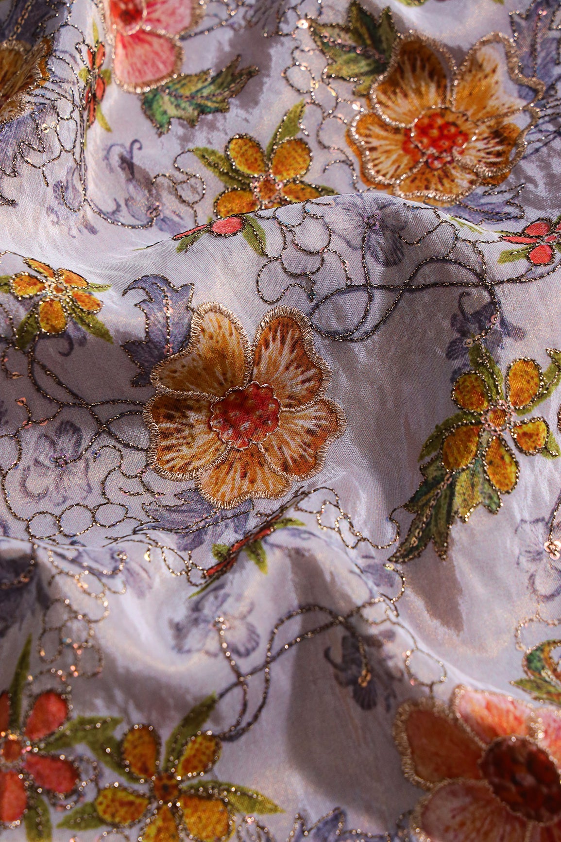 Floral Position Prints On Sequins With Zari Embroidery On Lilac Viscose Zari Tissue Fabrics